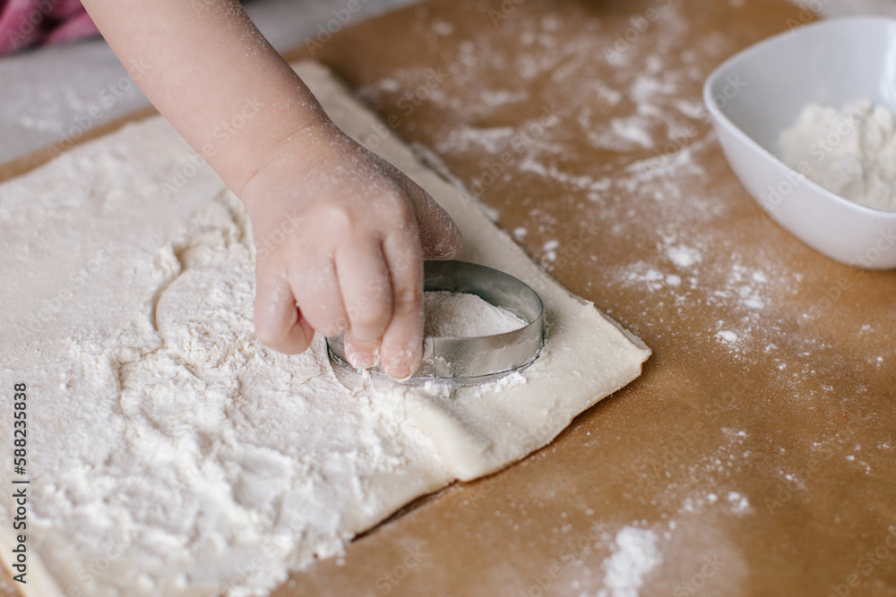 Little girl is making a egg. Easter preparation. Baking sheet. Family time. Little girl is making a egg. Easter preparation. Baking sheet. Family time.