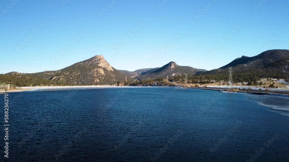 Lake Estes in Colorado on a cloudless day flying towards Mount Olympus during the winter, aerial Lake Estes in Colorado on a cloudless day flying towards Mount Olympus during the winter, aerial