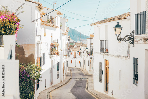 Altea old town with narrow streets and whitewashed houses. Architecture in small picturesque village of Altea near Mediterranean sea, Alicante province, Valencian Community, Spain © vejaa