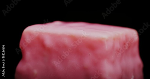 Delicious Pink Rum Cake Square Dessert Appetiser Rotating Macro photo