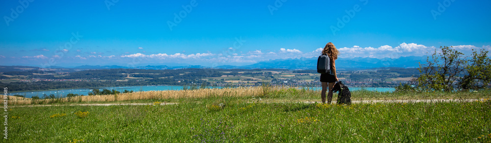 Woman and dog looking at panoramic view in France