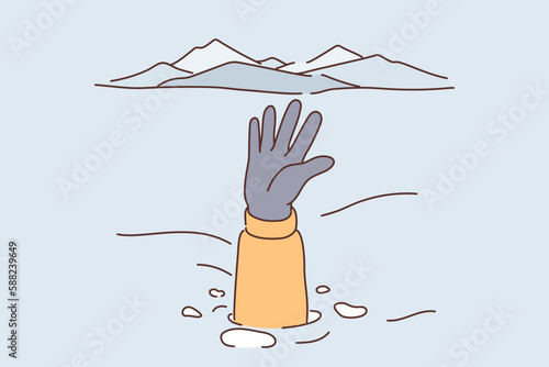 Person caught in avalanche stretches out hand and snowdrift to signal for help and attract rescuers