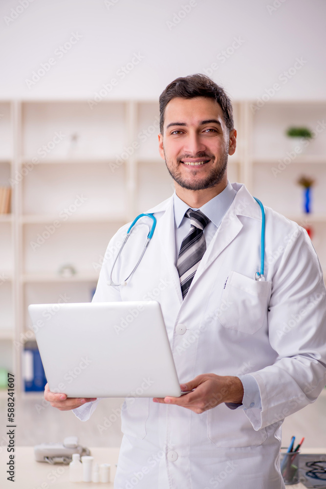 Young male doctor in telemedicine concept Young male doctor in telemedicine concept