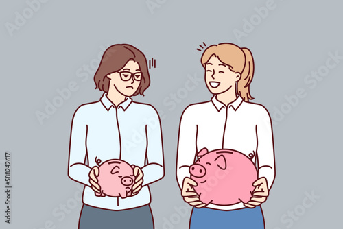 Two women with piggy banks for money of various sizes for concept of income inequality and different levels of wages. Comparison of savings on bank deposit or investments invested in pension account