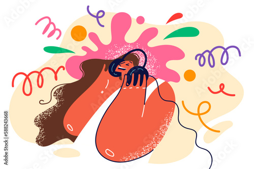 Woman in headphones listening to cool music enjoying good rhythm and quality sound