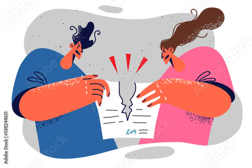 Quarreled spouses tear paper with prenuptial agreement after court session announcing divorce