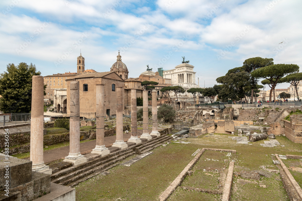 Ruins of Imperial Forums on a Summer day in Rome, Italy. Roman archaeological park.