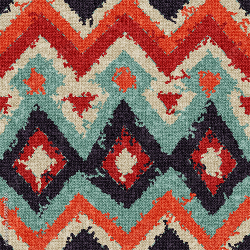 Seamless abstract pattern. Bohemian ornament for home decor, pillows, carpets. Grunge texture with fabric imitation. Vector illustration.