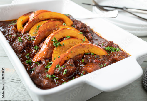 Poultry goulash with roasted pumpkin topping