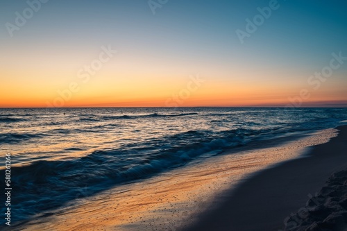 Beautiful colorful landscape on the beach by the sea. Sunrise over the Baltic Sea in Jastarnia  Poland.