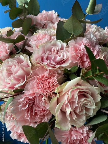 Slika na platnu Beautiful bouquet of fresh pink roses and fluffy carnations with green eucalyptu
