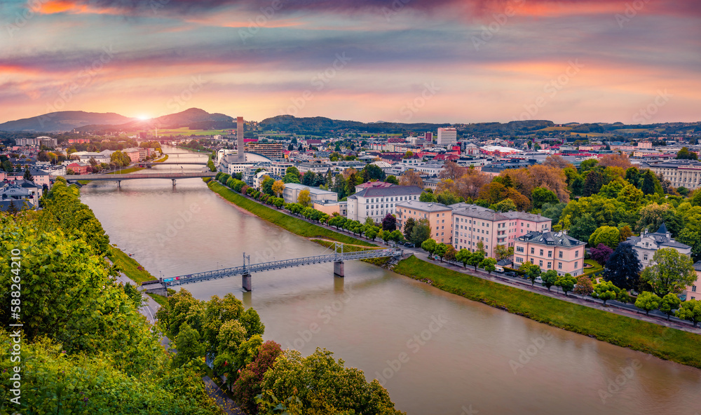 Picturesque sunrise in Salzburgtown, birthplace of Mozart. Colorful spring scene of Eastern Alps. Adorable landscape of Salzach river. Traveling concept background.