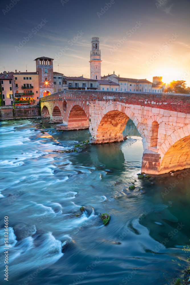 Verona, Italy. Cityscape image of beautiful Italian town Verona with the Stone Bridge over Adige River at sunset.