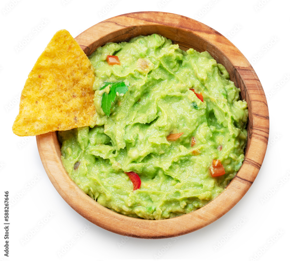 Guacamole bowl and corn chips dipped on white background. Top view. File contains clipping path. Guacamole bowl and corn chips dipped on white background. Top view. File contains clipping path.