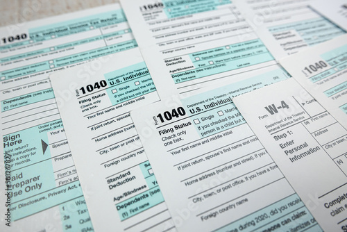 Blank 1040 individual income tax return on desk