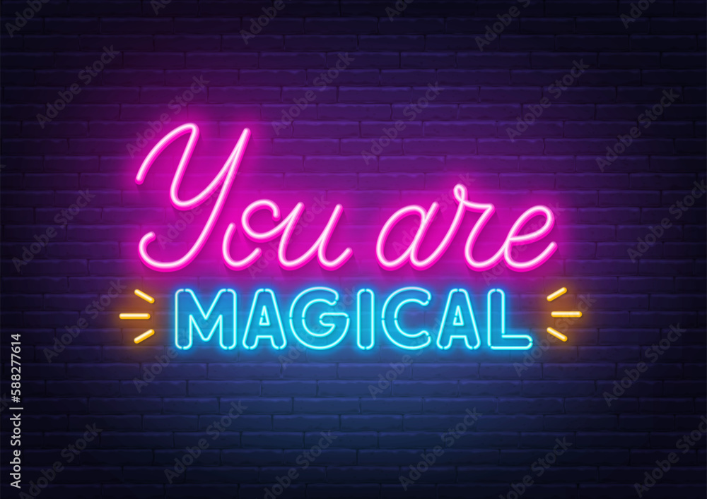 You Are Magical neon lettering on brick wall background.