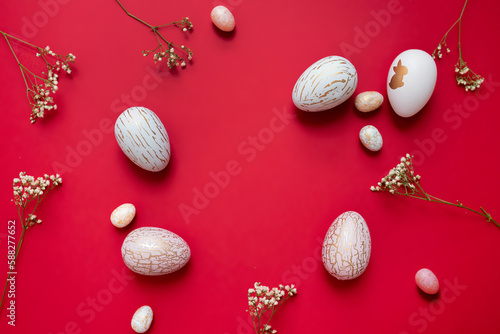 Photography easter eggs, flowers on a red bright background