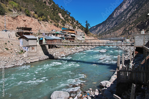 The bridge on Swat river in the valley of Himalayas, Pakistan photo