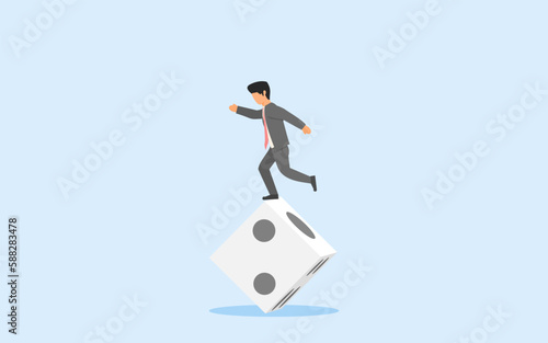 concept of uncertainty. investment risk. business challenge. businessman standing on unstable dice