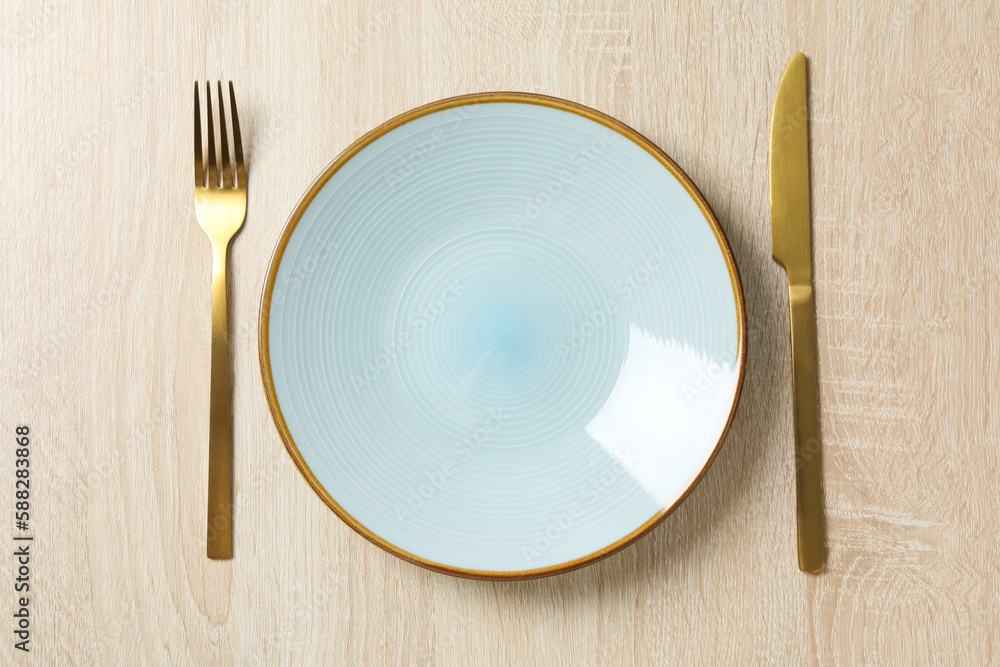 Minimal table setting with blank dish, top view Minimal table setting with blank dish, top view