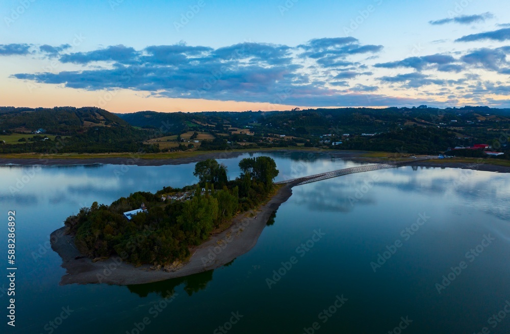 Obraz premium Bird's-eye view of the Aucar Island connecting with land with a wooden walkway