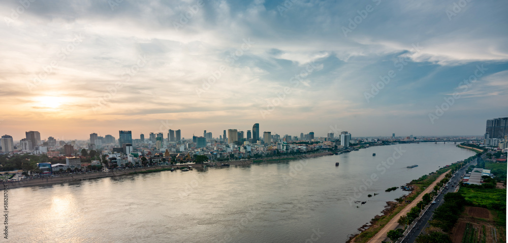 Phnom Penh city panorama, at sunset,viewed from eastern side of the Tonle Sap River,Cambodia. Phnom Penh city panorama, at sunset,viewed from eastern side of the Tonle Sap River,Cambodia.
