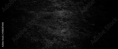 Abstract structured black concrete wall background  scary black grunge goth design. horror black background  Slightly light black concrete cement texture for background. 