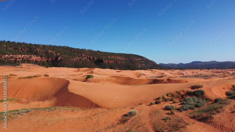 Coral Pink Sand Dunes State Park - Unique Desert Landscape With Vivid Pink-hued Sand Dunes In Southwestern Utah, USA. wide aerial Coral Pink Sand Dunes State Park - Unique Desert Landscape With Vivid Pink-hued Sand Dunes In Southwestern Utah, USA. wide aerial