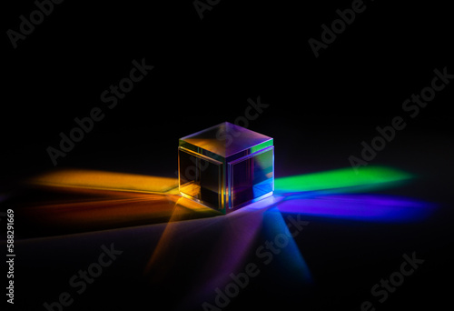 a glass cube reflects many colors