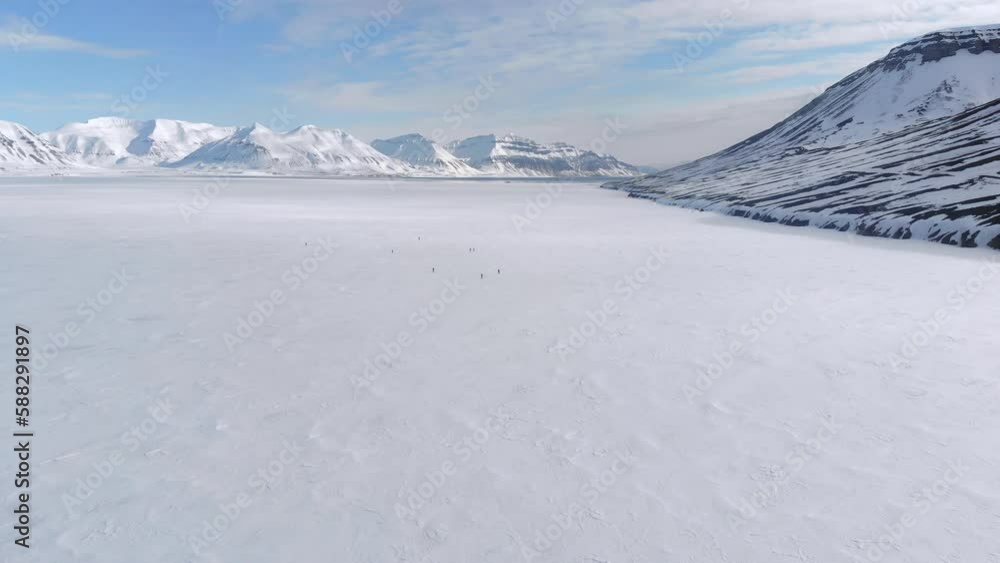 Beautiful view of a landscape with mountains covered with snow under cloudy sky in Spitsbergen Beautiful view of a landscape with mountains covered with snow under cloudy sky in Spitsbergen