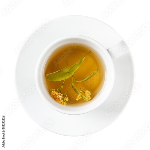 Linden tea in white cup with saucer isolated on white background. Top view.