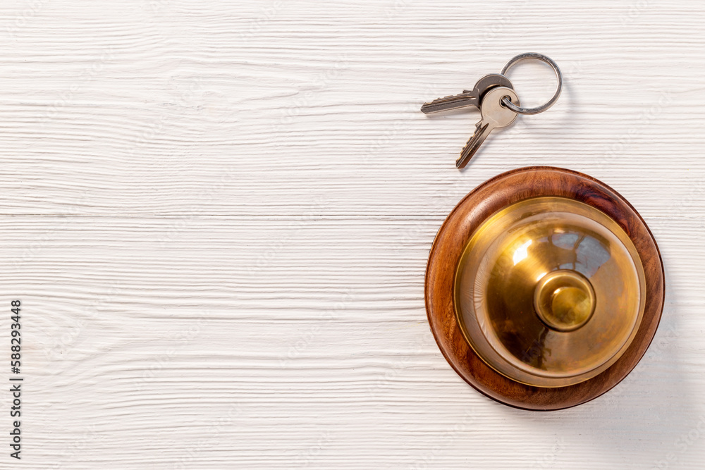 Hotel service bell with keys. Booking and checkin concept Hotel service bell with keys. Booking and checkin concept