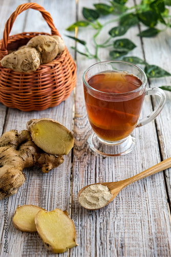 Ginger, tea on the wooden table, teh jahe