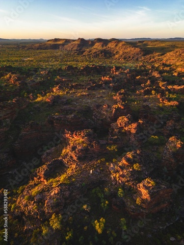 Aerial view of a mountainous landscape under a blue sky