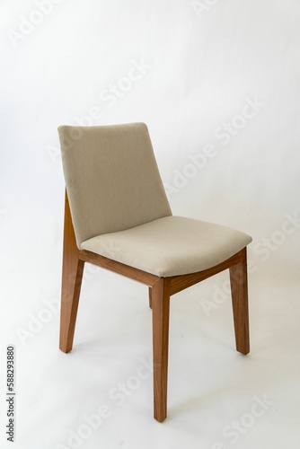 Single white round chair on a white background.