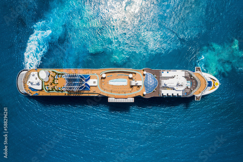 The Bahamas, 27 June 2020: Aerial View of the Celebrity Edge cruise ship manoeuvring in clear water, the Bahamas. photo