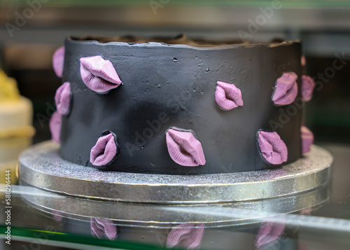 Chocolate cake decorated with sweet pink lips photo