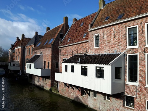 The famous hanging kitchens over the Damsterdiep canal in Appingedam in Groningen, the Netherlands photo