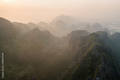 Aerial view of Khu Bao Ton hilly landscape at sunset, Gia Vien, Vietnam. photo