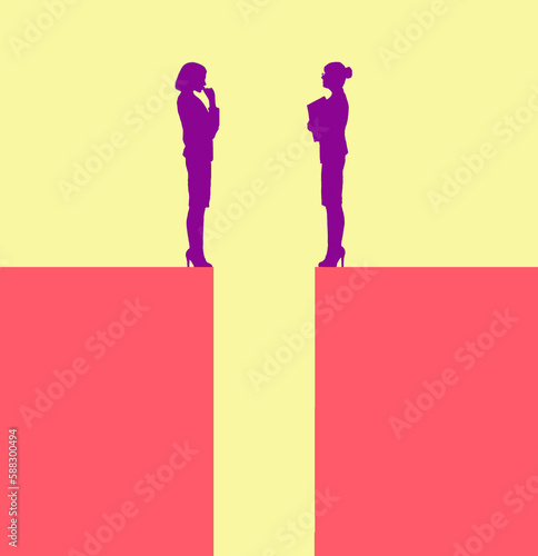 Two businesswomen talking from edges of separate blocks photo