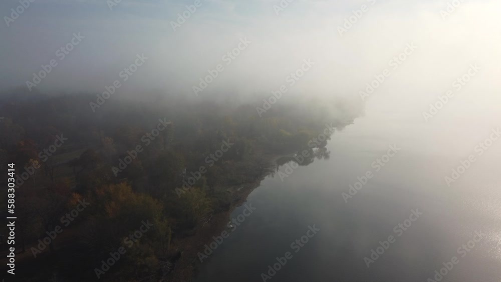 Aerial Misty fog flying through pinery provincial park near the shore line Aerial Misty fog flying through pinery provincial park near the shore line