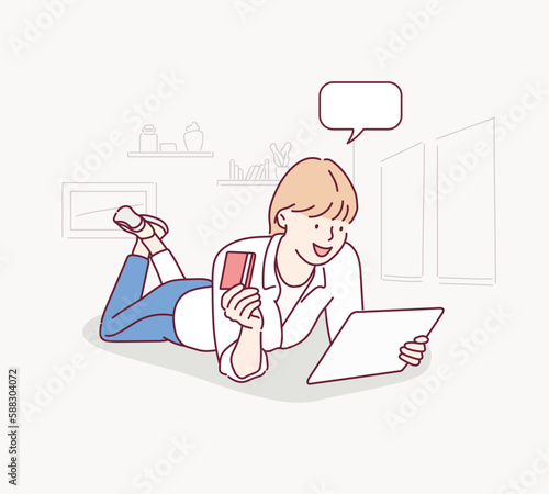 Woman with tablet isolated on the white background. Online shopping concept. Hand drawn style vector design illustrations.