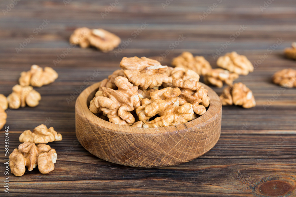 Fresh healthy walnuts in bowl on colored table background. Top view Healthy eating bertholletia concept. Super foods Fresh healthy walnuts in bowl on colored table background. Top view Healthy eating bertholletia concept. Super foods