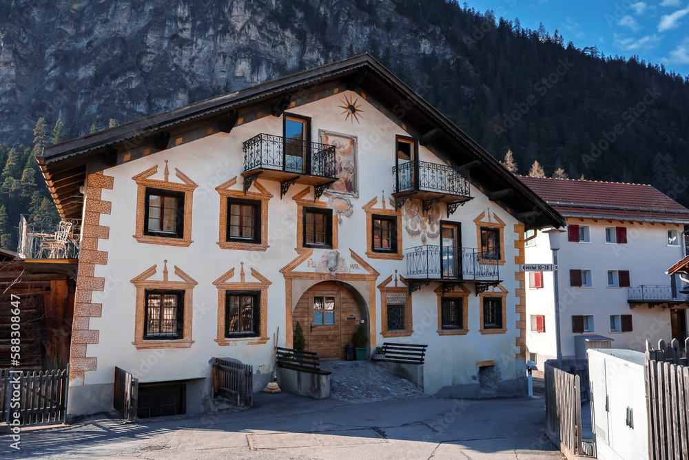 Exterior of houses with majestic mountain in background at Swiss Alps, Winter holiday travel concept