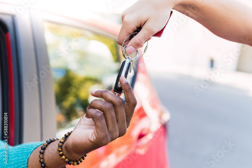 Man taking car key from valet