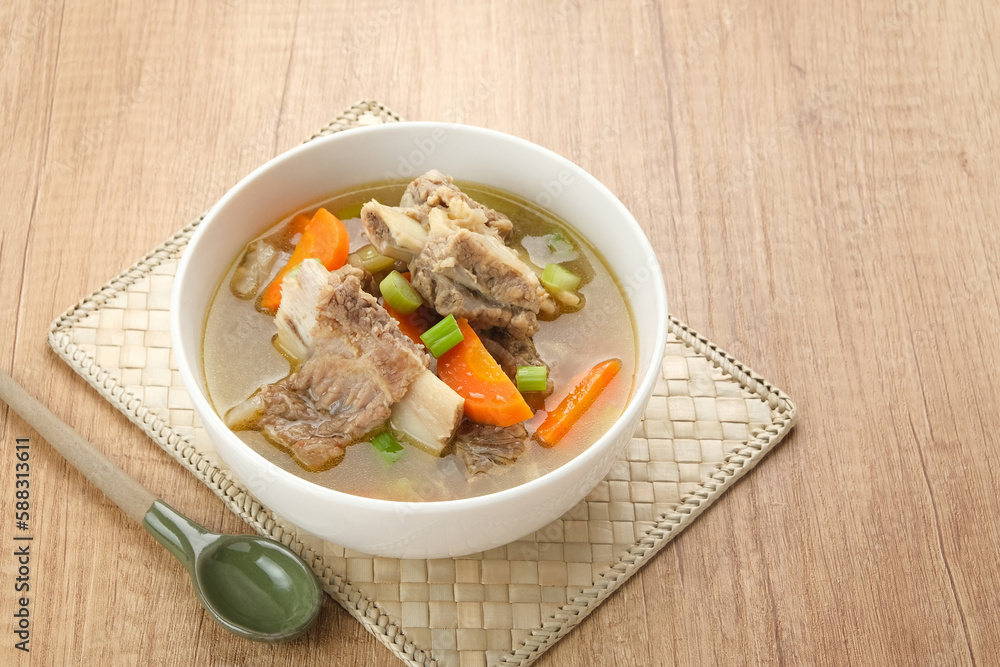Sop Iga (Beef ribs soup) made from ribs, carrots, leeks. Served in white bowl. Indonesian food Sop Iga (Beef ribs soup) made from ribs, carrots, leeks. Served in white bowl. Indonesian food
