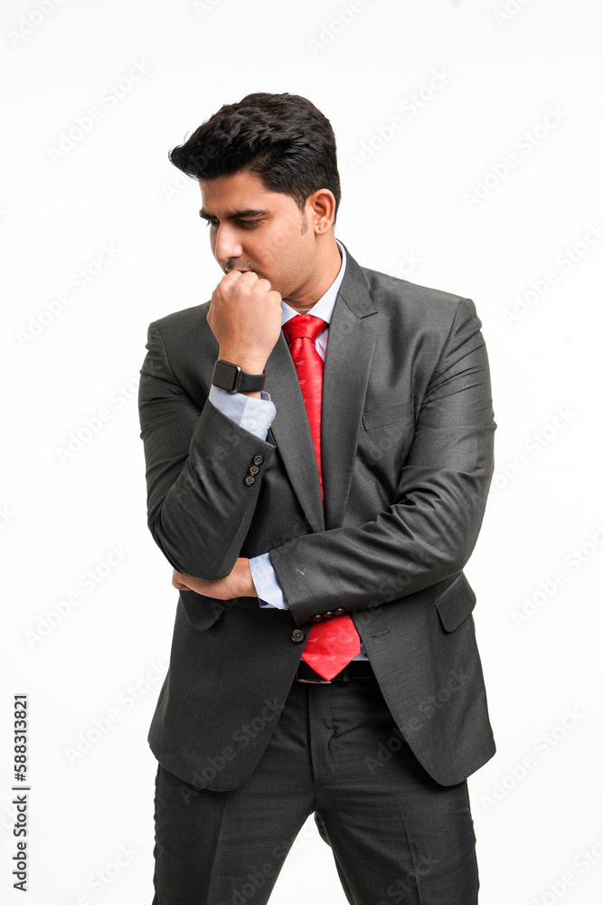 Young indian businessman in classic suit giving expression. Young indian businessman in classic suit giving expression.