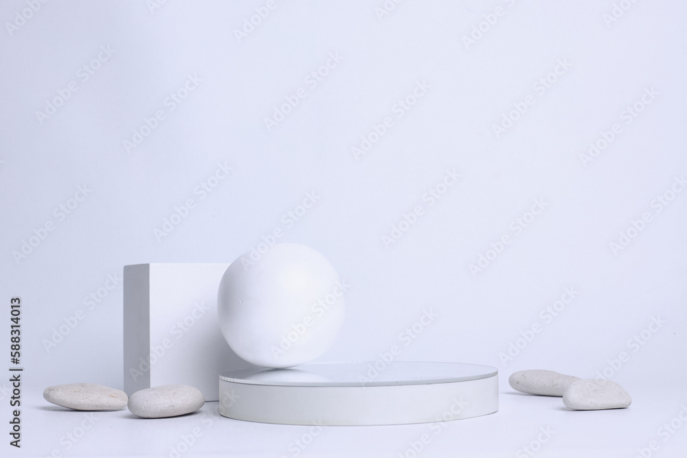 White creative podium in various geometric arrange with white stone. Blank space for product mock up in minimalist concept. White creative podium in various geometric arrange with white stone. Blank space for product mock up in minimalist concept.