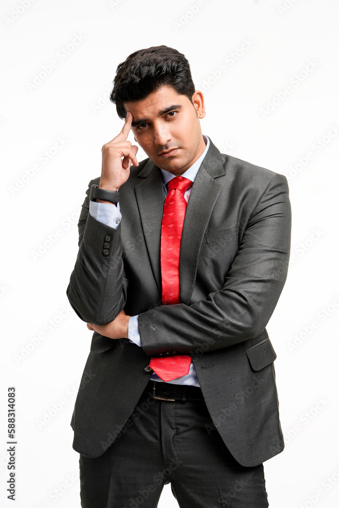 Young indian businessman in stress or thinking some on white background. Young indian businessman in stress or thinking some on white background.