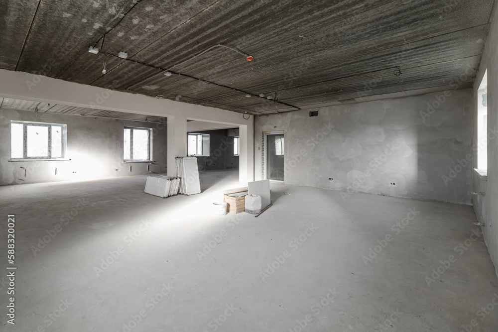 Spacious empty rooms in the attic floor after filling out the work on the wall and ceiling Spacious empty rooms in the attic floor after filling out the work on the wall and ceiling
